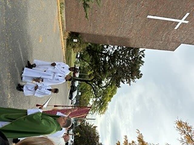 Blessing of the new cross outside Église Sainte-Angèle