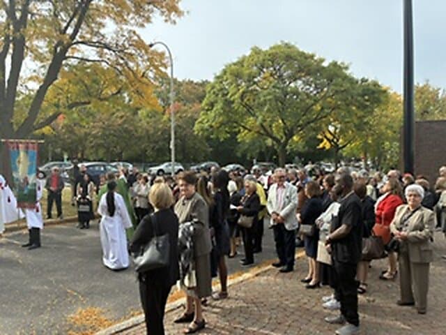 Blessing of the new cross outside Église Sainte-Angèle