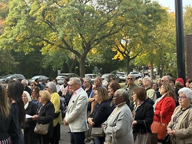Blessing of the new cross outside Église Sainte-Angèle